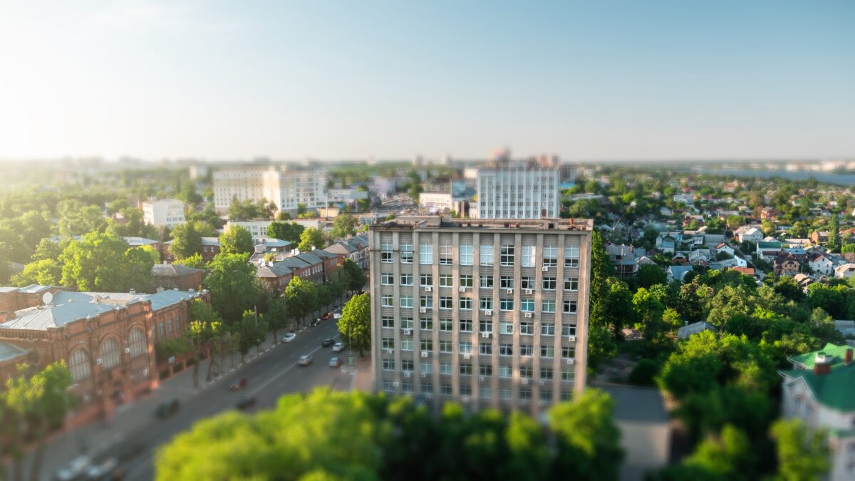 Tilt shift blurred city Voronezh, panoramic modern cityscape skyline in summer sunny day, aerial view