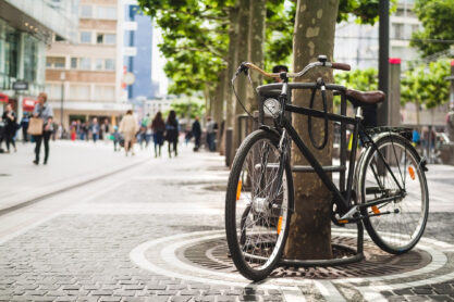 Bike standing near a platan tree in Frankfurt, Germany. Summer in Europe