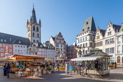 Trier, GERMANY - MARCH 03: Marketplace in Trier with its colourful stalls with merchants selling flowers and souvenirs.
