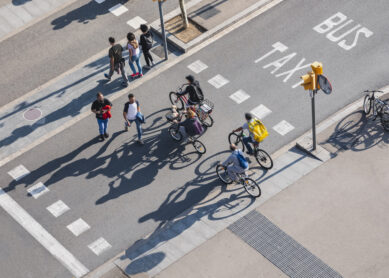 People crossing street Cycling and Walking Traffic sign Smart city Urban lifestyle outdoor