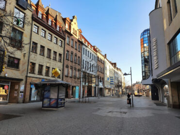 Ort, Land - January 01, 2020: Pedestrian zone 'Breite Gasse / Ludwigsplatz' in Nuremberg, Germany. Clothing store Wormland in front and other shops. It is a famous shopping street.