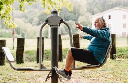 senior man exercising at outdoor gym