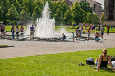 People celebrating summer in Lustgarten park in Berlin