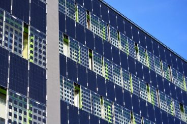 The walls of the building are tiled with solar panels.