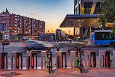 Madrid Spain. August 14, 2022. Parking for bicycle rental in Plaza Castilla next to the bus station. Dusk. Long exposure