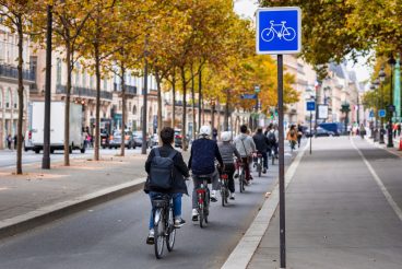 Cyclists on the bike path along the Seine in Paris. France