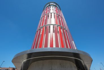 Wismar, Germany, June 16, 2020: Public multi storey car parking garage in the old harbor of Wismar, Germany, modern architecture against a blue sky