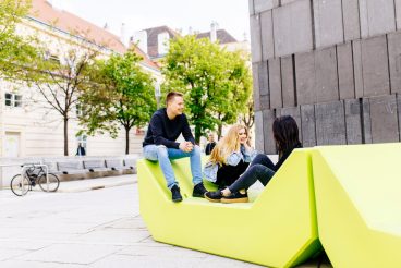 Young people sitting on the lounge seats in Vienna, Austria